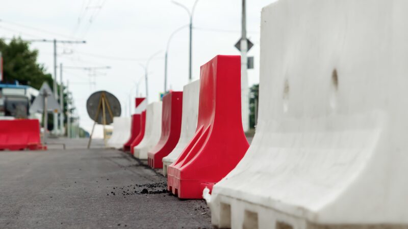 What is the advantage of using road barriers?